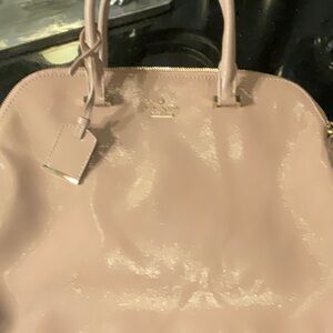 Original Kate spade, tan/ mauve color. Excellent condition.